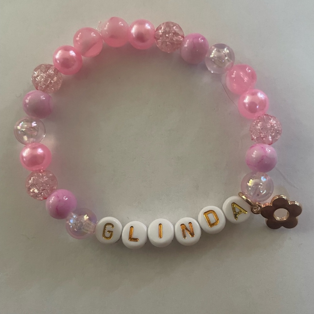 Glinda bracelet with gold flower charm